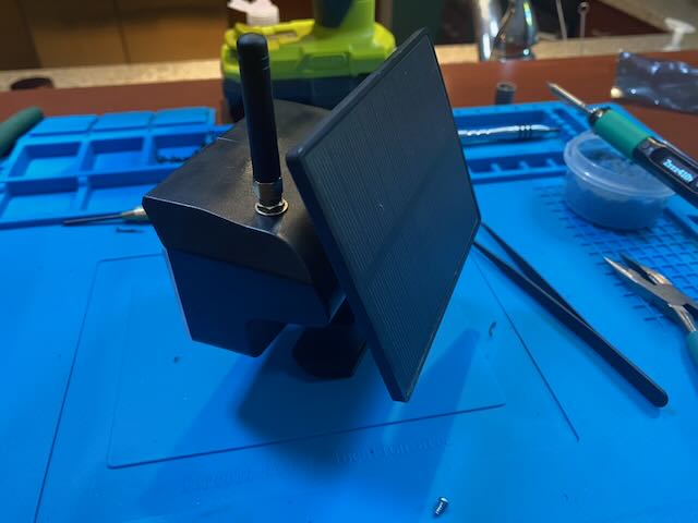 Assembled jank node with solar panel and antenna on the bench